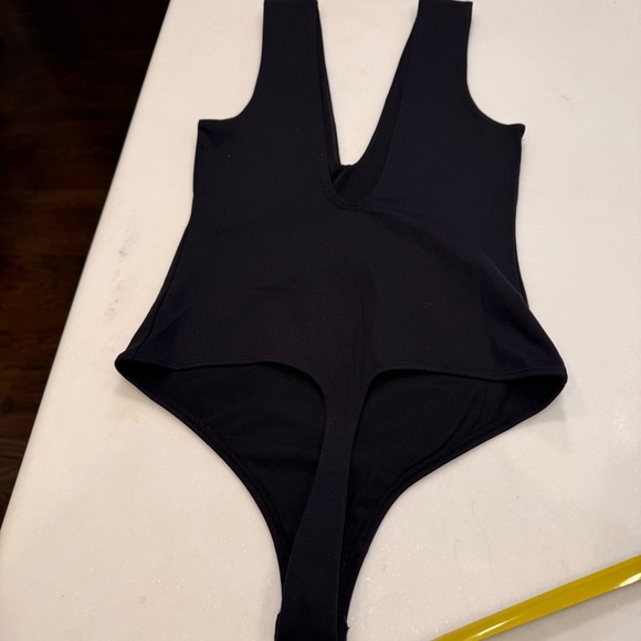 Free People Woman’s Keep It Sleek Bodysuit size XS solid Black Deep V NWOT - Picture 9 of 9